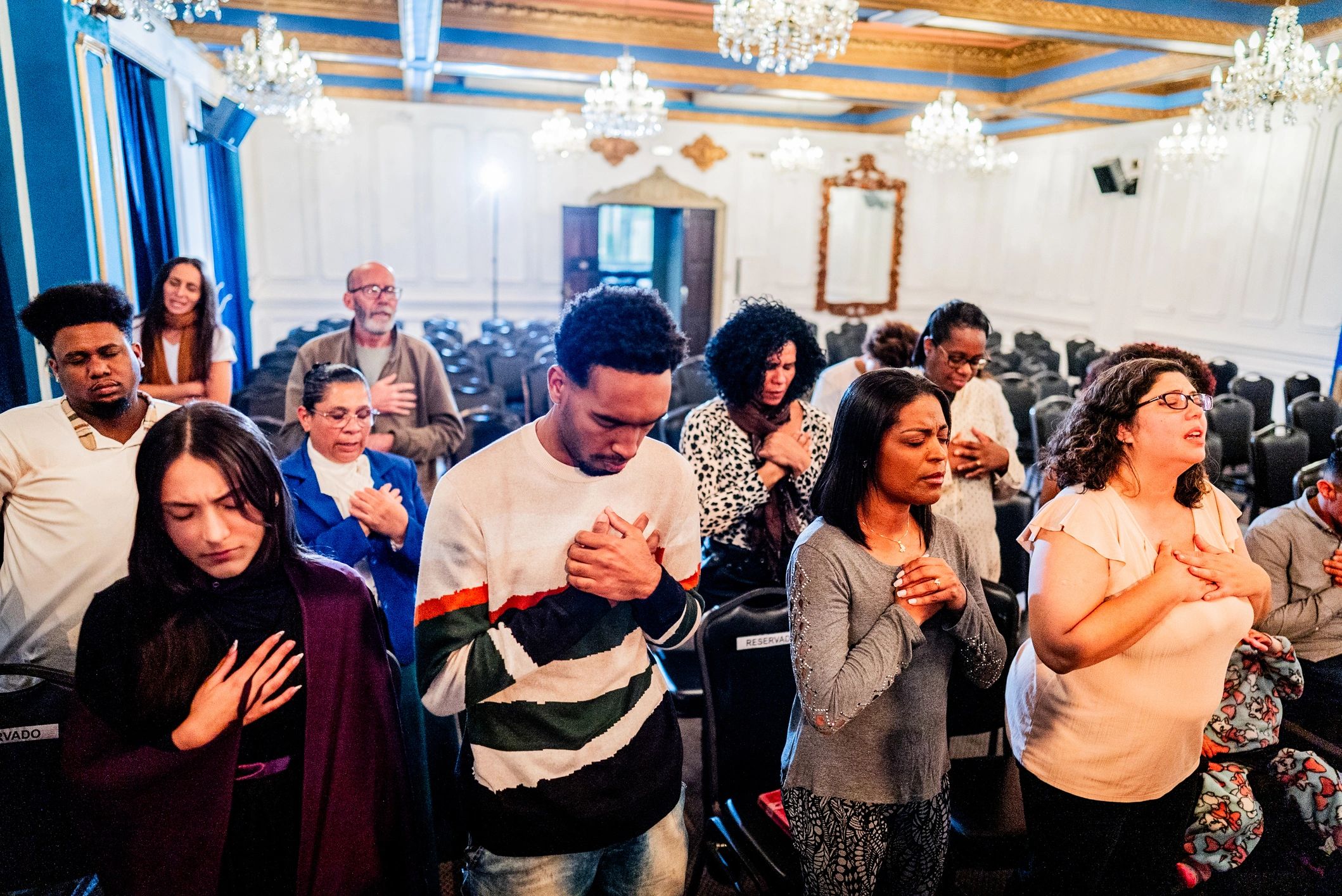 Worshippers praying together during a church service